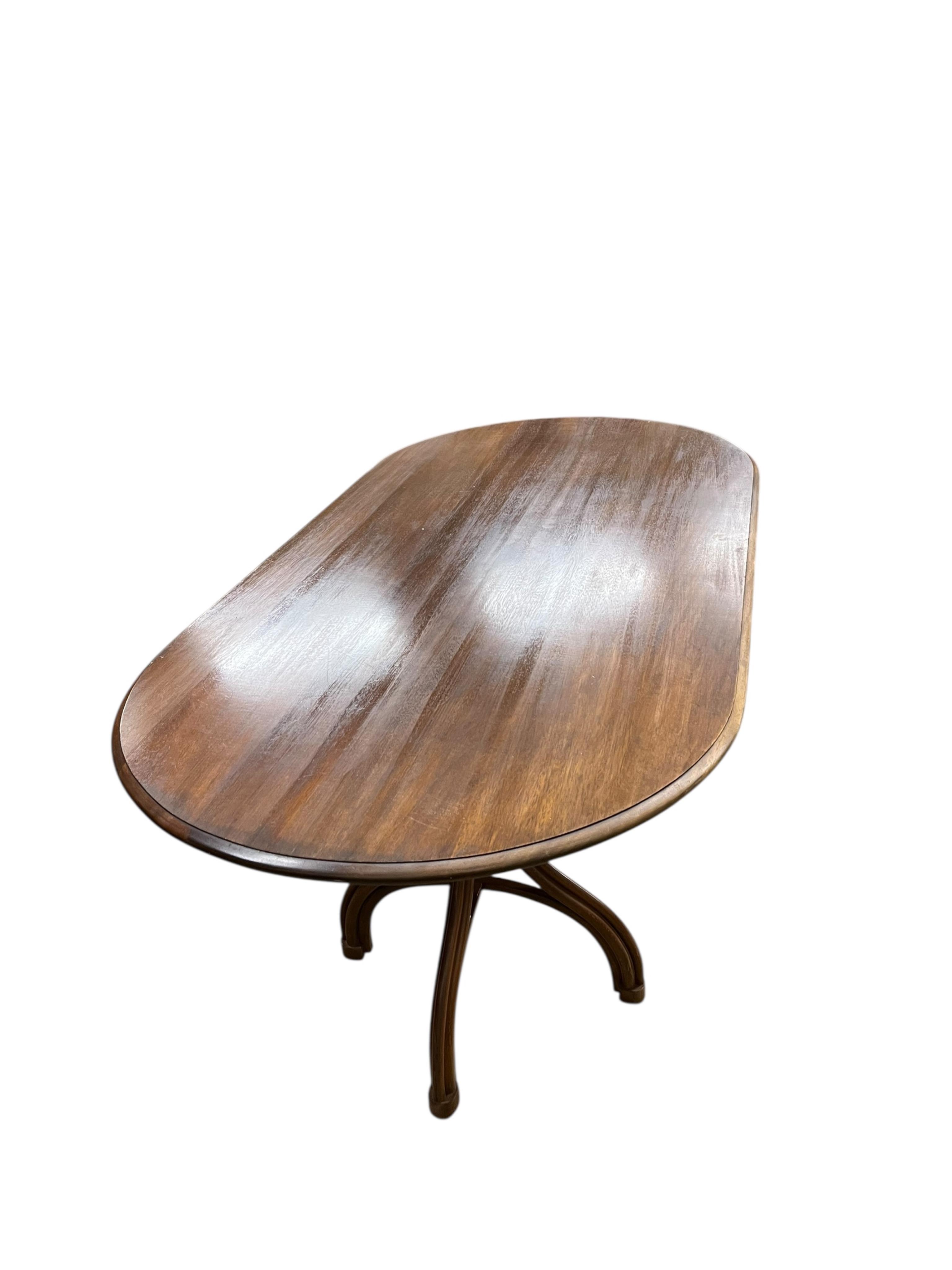 A Dinette caned beech and mahogany bentwood dining suite, comprising: dining table, width 180cm, depth 90cm, height 76cm and six elbow chairs